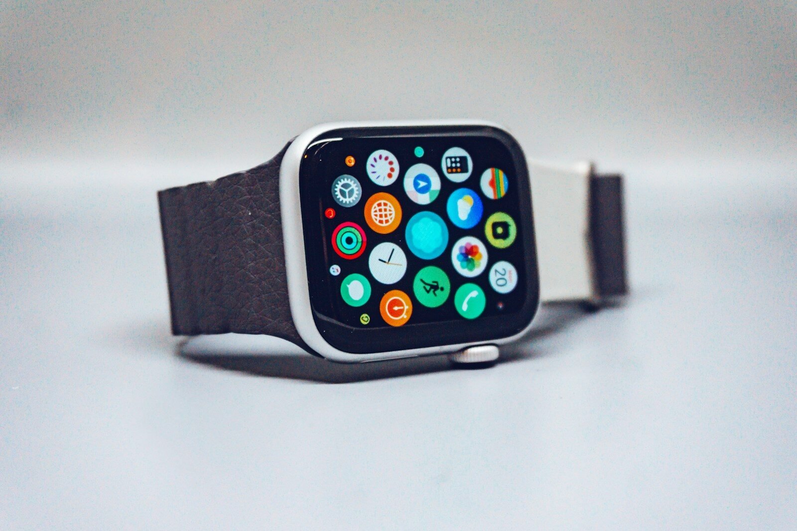 Smartwatch with a dark textured band and colorful app icons on its display, illustrating a smartwatch buying guide